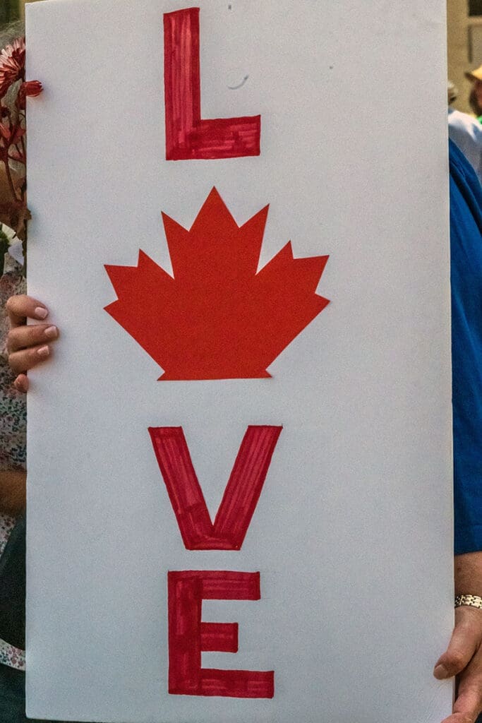 Sign with 'Love' and Canadian maple leaf emblem.