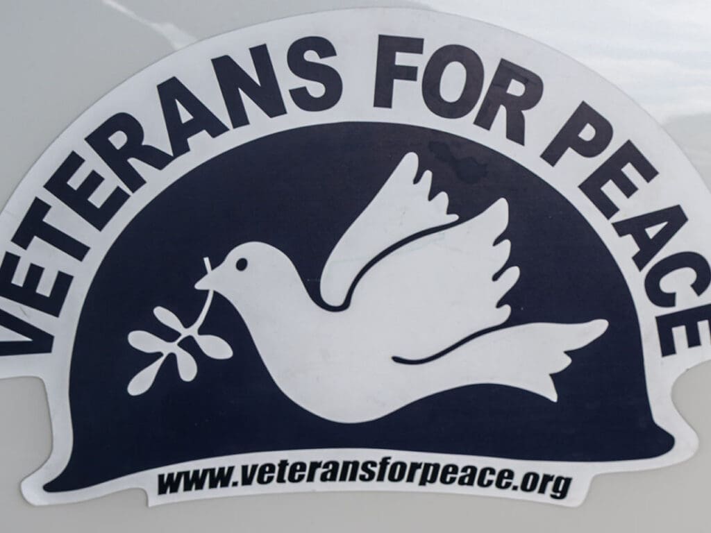 Veterans for Peace logo with dove and olive branch.