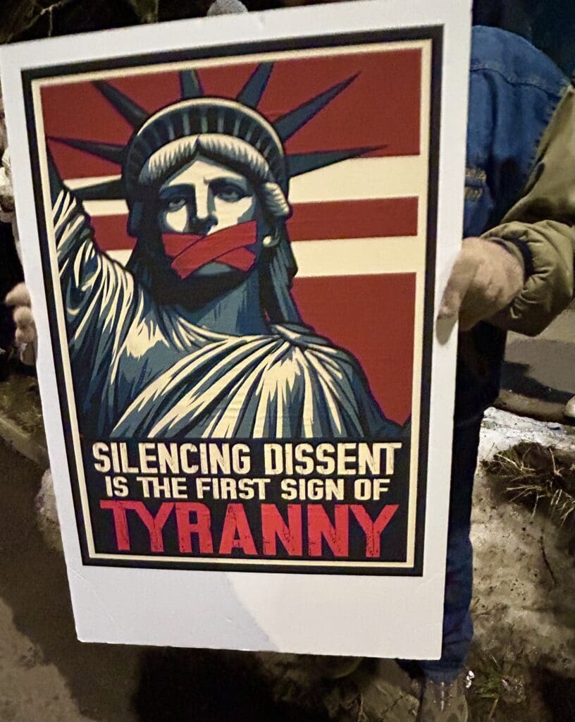 Protest poster: Statue of Liberty silenced, tyranny warning.