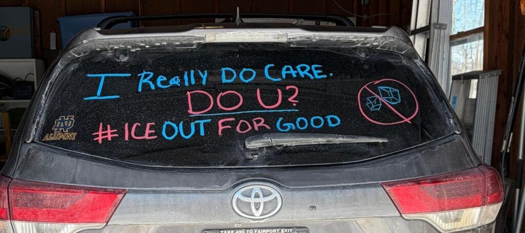 Car window with anti-ice message.