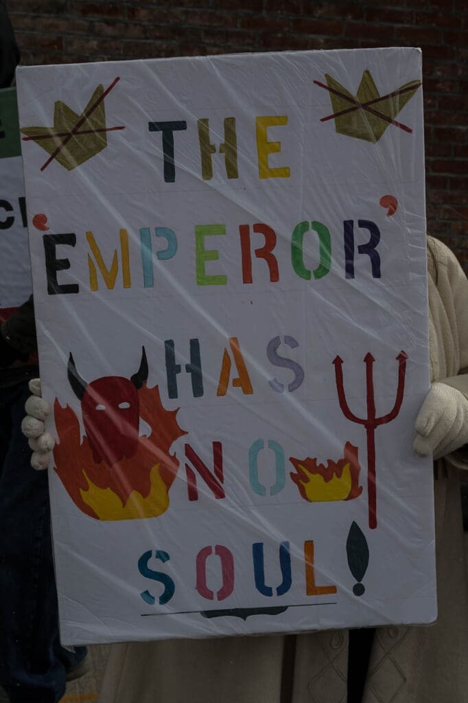 Protest sign reading 'The Emperor Has No Soul!'