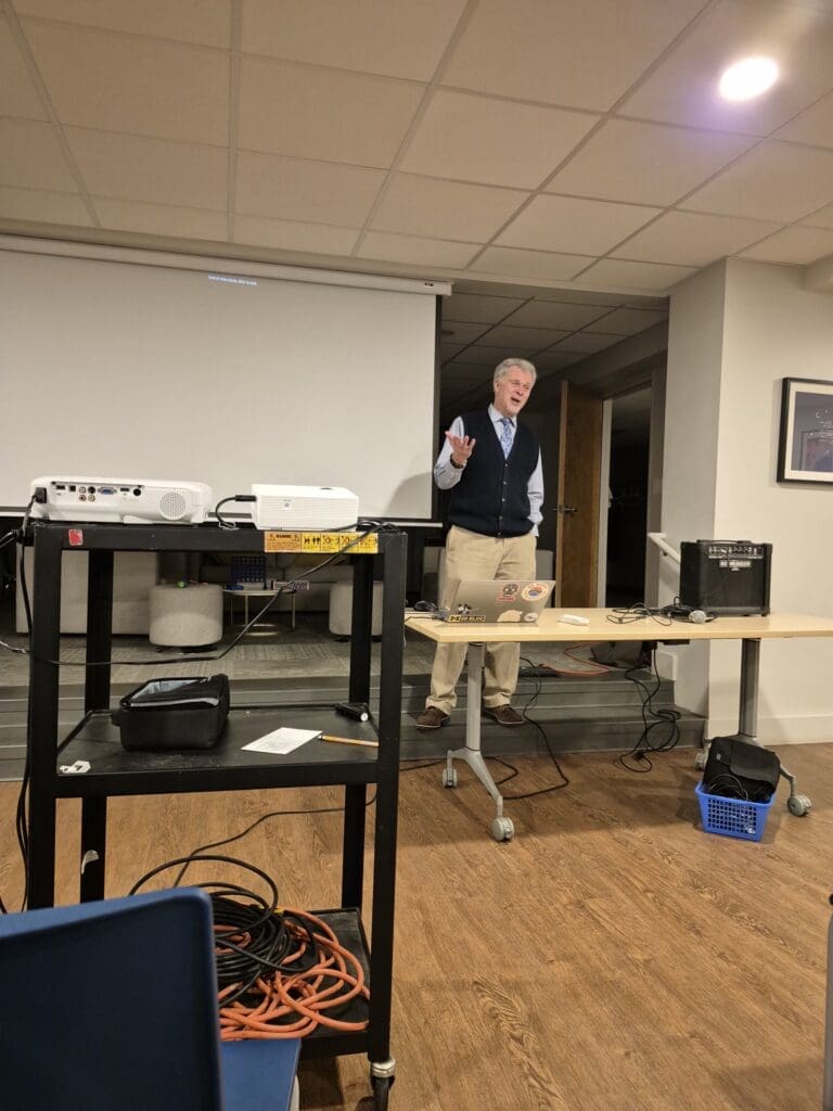 Man giving presentation in small conference room