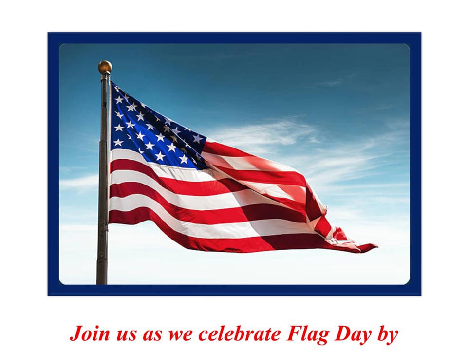 American flag waving on pole against blue sky